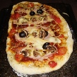 Pizza Spezial vom heissen Stein